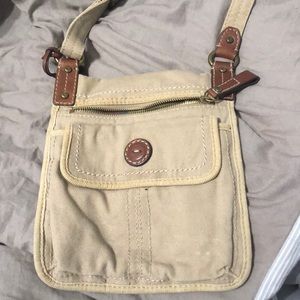 A tan fossil over the shoulder bag